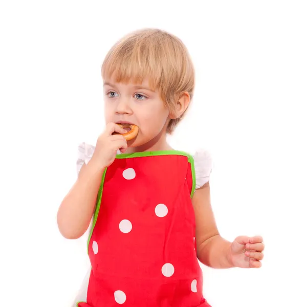 Маленька дівчинка їсть багель — стокове фото