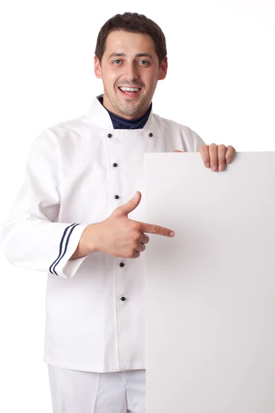 Chef cook showing at blank board. — Stock Photo, Image