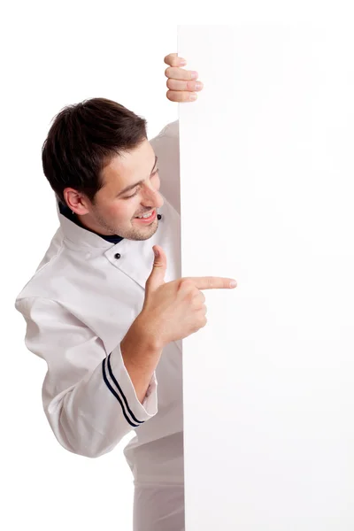 Kuchař kuchař ukazující na prázdné desky — Stock fotografie