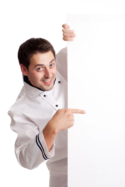 Kuchař kuchař ukazující na prázdné desky — Stock fotografie