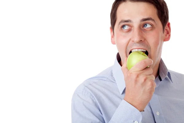 Man med grönt äpple. — Stockfoto
