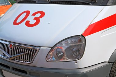 Car to ambulance on road clipart