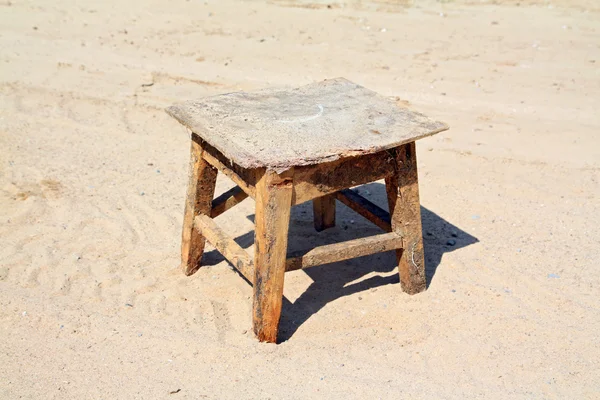 Old stool on sandy road — Stock Photo, Image