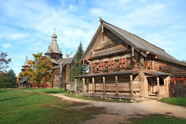 Aging wooden chapel in village clipart