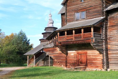 Aging wooden chapel in village clipart