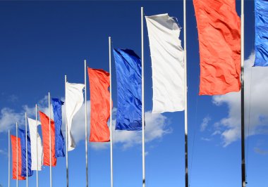 Flags on a blue background clipart