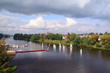 Sailboat on river clipart