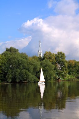 Sailboat on river clipart