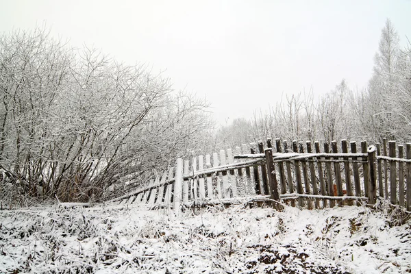 Old fence in snow — Stock Photo, Image