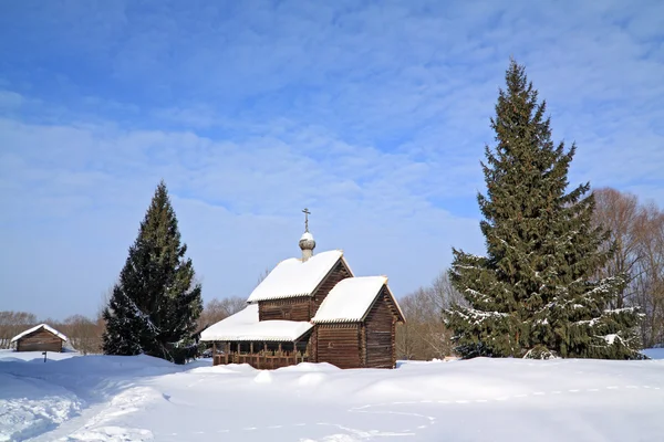 Wooden chapel in winter village — Stock Photo, Image