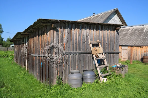 Rural shed on green herb — Stock Photo, Image