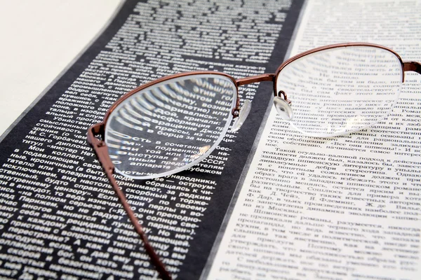 stock image Spectacles on newspaper