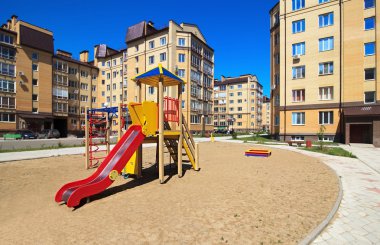 Children's playground in the new neighborhood. clipart