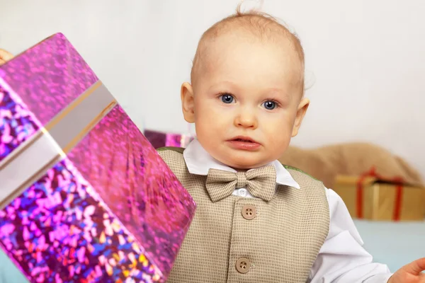 One year old baby with gifts. Day of birth. — Stock Photo, Image