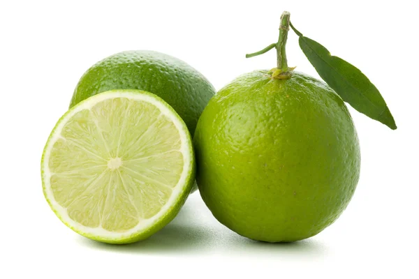 Two and half ripe limes — Stock Photo, Image