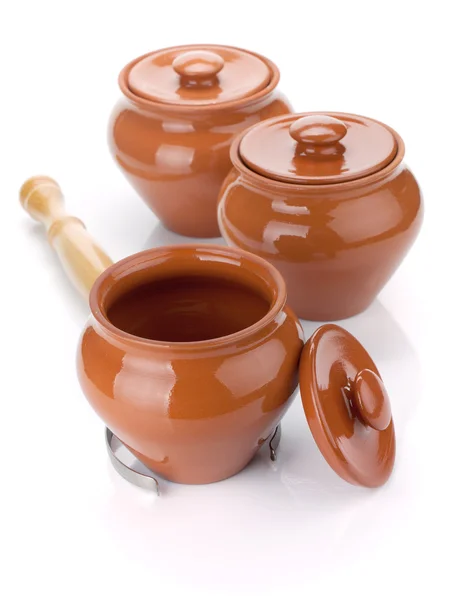 Three clay pots and holder — Stock Photo, Image
