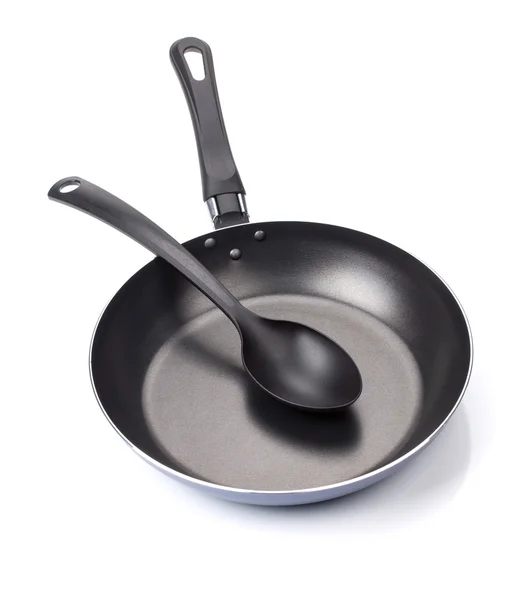 Frying pan with utensil — Stock Photo, Image