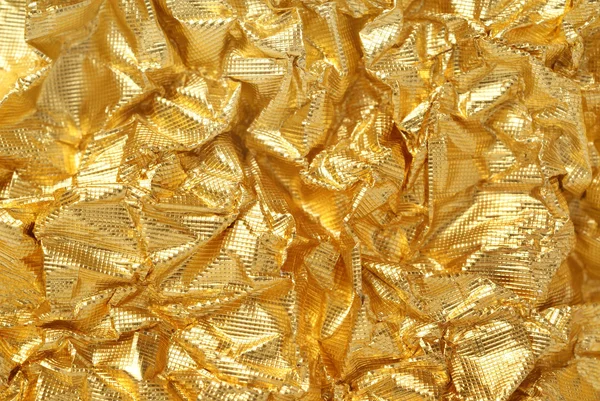 Künstlerischer Hintergrund aus goldener Folie — Stockfoto