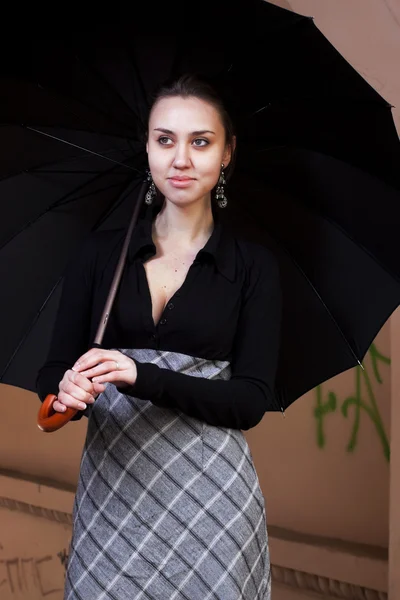 Woman holds umbrella — Stock Photo, Image