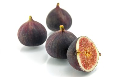 Ripe fig isolated on a white background clipart