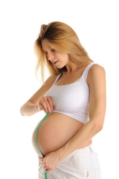 Mujer embarazada medida vientre —  Fotos de Stock