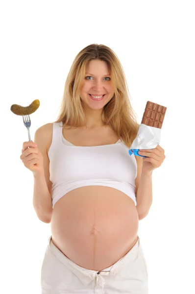 Happy pregnant woman with chocolate and pickles — Stock Photo, Image