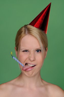 Woman with candle in tongue and festive cap clipart