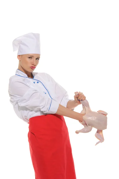 Woman- cook put her hand to raw chicken — Stock Photo, Image