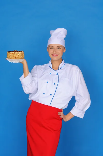 Boldog asszony-cook gazdaság torta — Stock Fotó