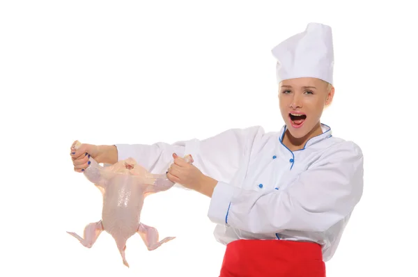 Happy woman-cook raw chicken — Stockfoto