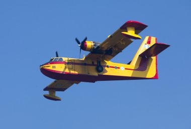 Fire fighting aircraft drops water clipart