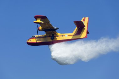 Fire fighting aircraft drops water clipart