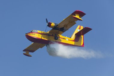 Fire fighting aircraft drops water clipart