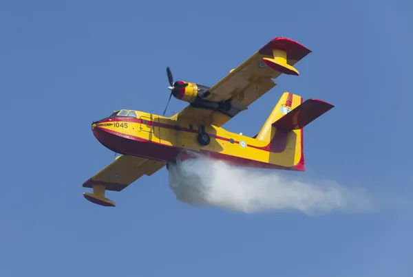 Fire fighting aircraft drops water