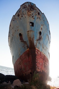 Old laid up ship stranded on land clipart