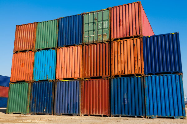 Stacked color cargo containers under the blue sky at the container yard in Thessaloniki port. Greece