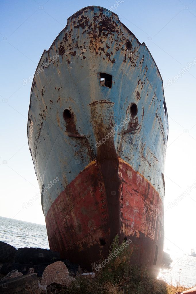 Old laid up ship stranded on land