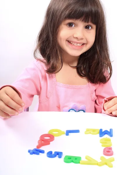 Girl and letters — Stock Photo, Image