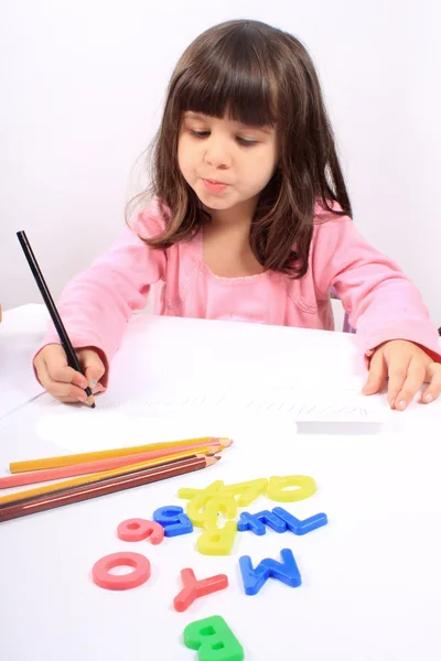 Little preschooler drawing or writing — Stock Photo, Image