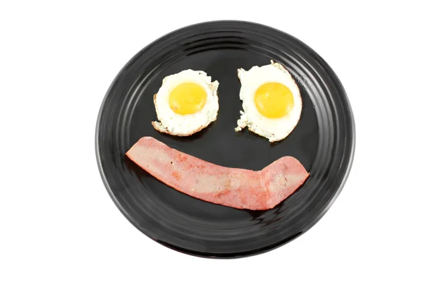 Jajka na bekonie uśmiech — Zdjęcie stockowe