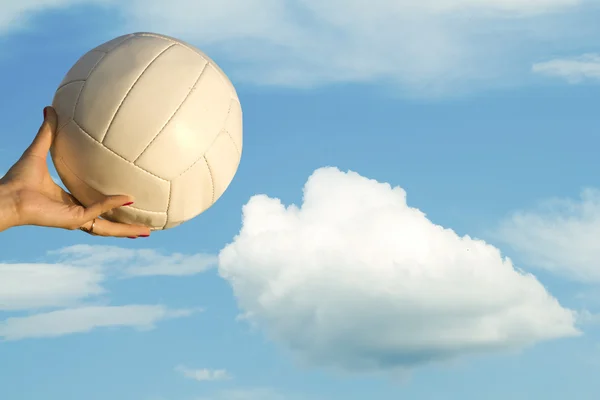 Female hand ball sky clouds — Stock Photo, Image