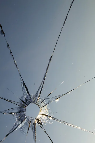 Glasfönster sköt sönder Stockbild