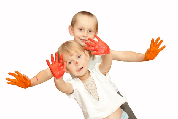 Niños con las manos en la pintura aisladas en blanco — Foto de Stock