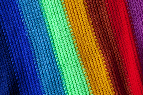 Closeup of the texture of a knitted rainbow scarf — Stock Photo, Image