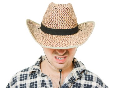 Cowboy hat pulled down over his eyes. clipart
