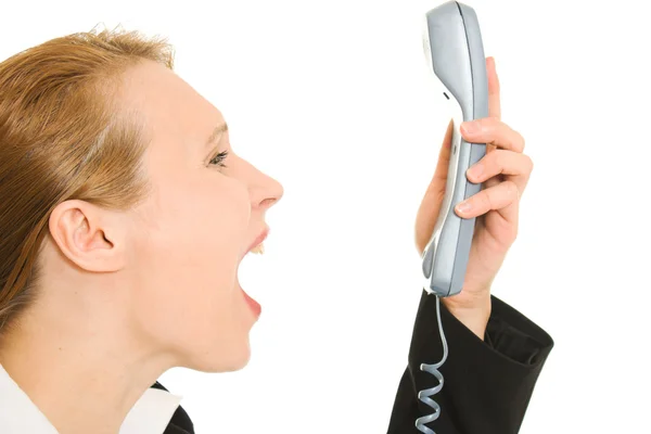 Empresária gritando para o telefone em um fundo branco . — Fotografia de Stock