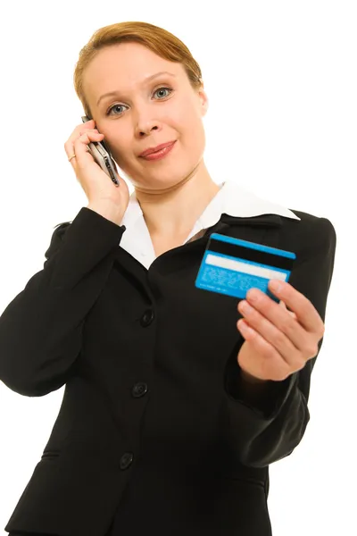 Empresaria con tarjeta de débito y teléfono móvil sobre fondo blanco . — Foto de Stock