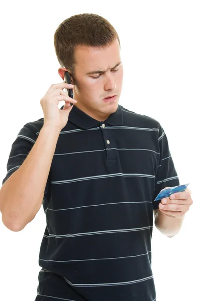 Man met een debit-card op een witte achtergrond. — Stockfoto