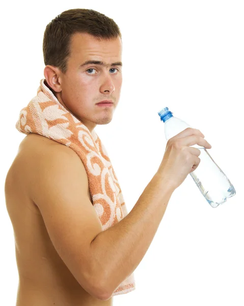 Man with towel drinking water — Stock Photo, Image