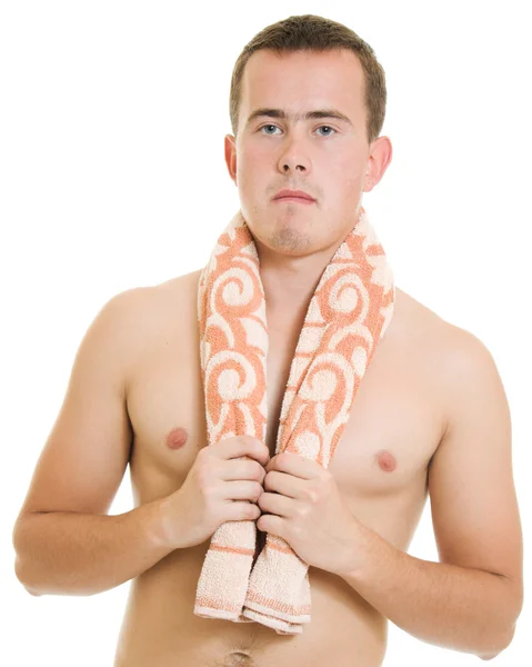 Un uomo con un asciugamano su sfondo bianco. — Foto Stock
